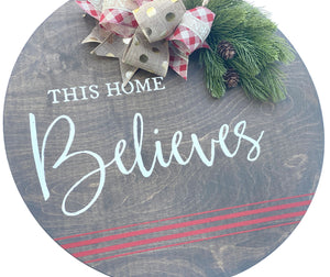 This Home Believes Christmas Round Door Hanger with Bow and Greenery