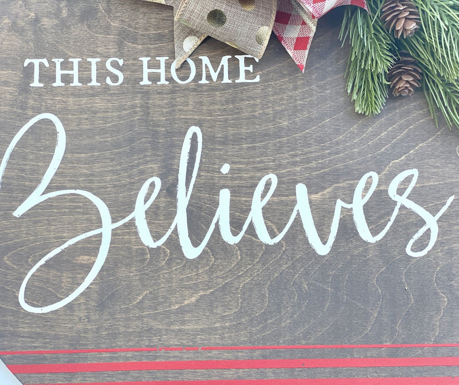 This Home Believes Christmas Round Door Hanger with Bow and Greenery